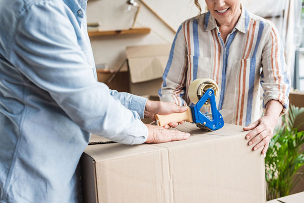 Silver Spring seniors packing a box