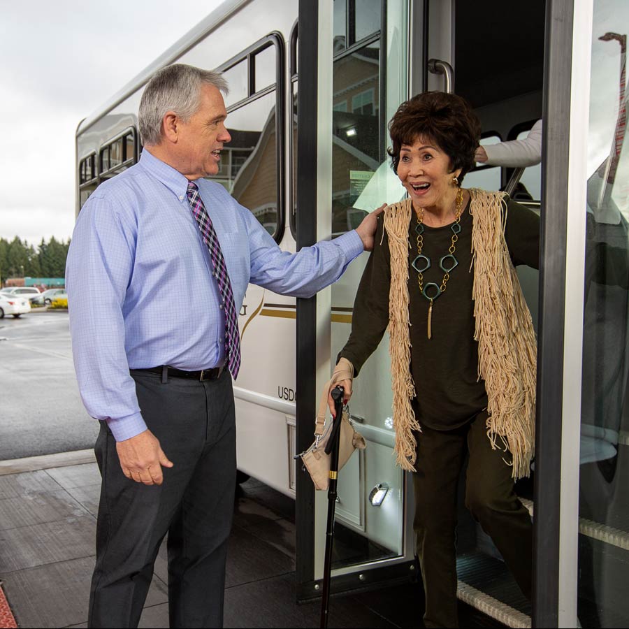 Wilshire Estates helping lady off bus